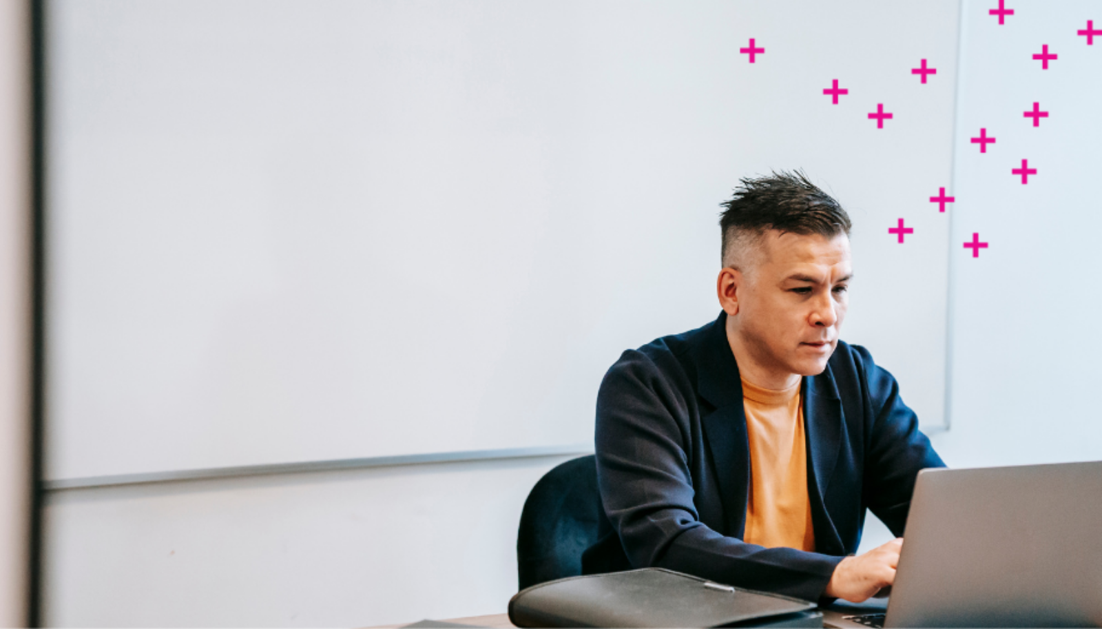 Man typing on laptop