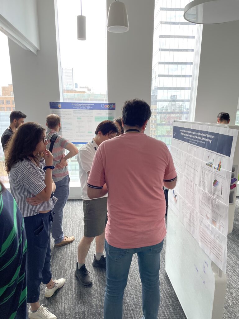 Graduate students present their research during a poster session. 
